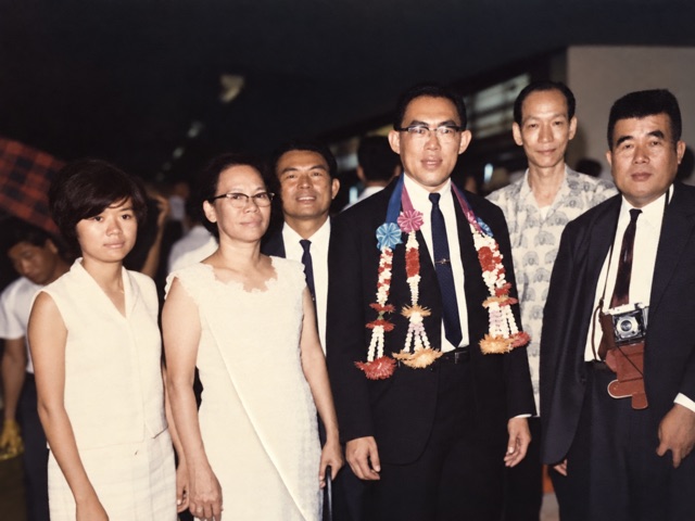 A group portrait with garlands