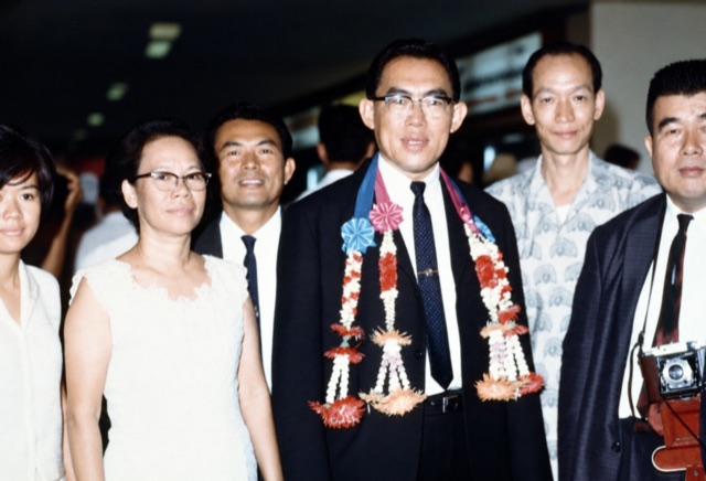 A group portrait with garlands